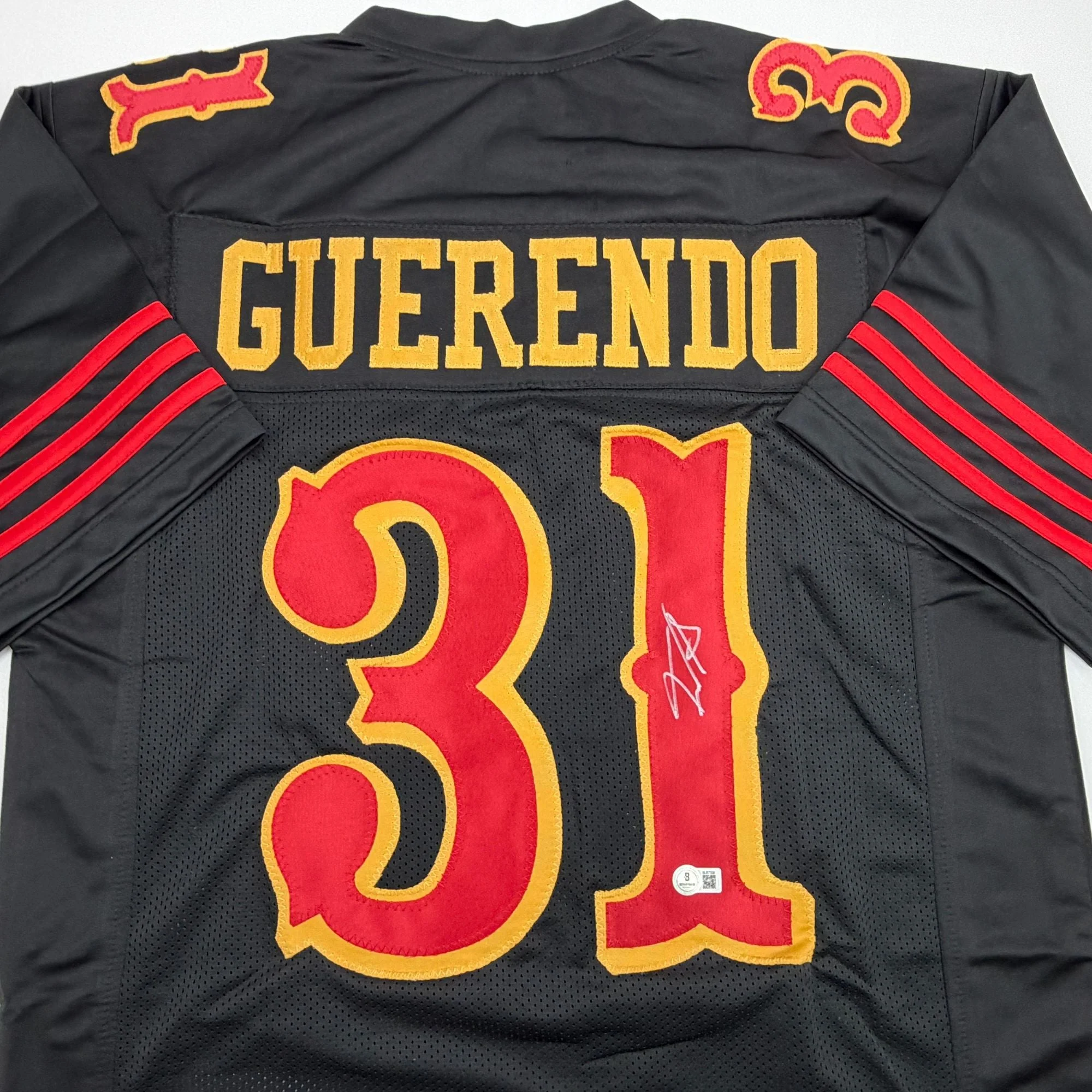 Autographed/Signed Isaac Guerendo San Francisco Black Rivalries Collection Football Jersey Beckett BAS COA - Image 2